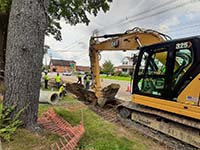 Installing 18-inch Drain Pipe in front of #109 and #111 Main Street